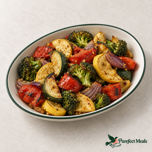 Fire-roasted mixed vegetables with nutritional yeast in an ivory oval dish on white