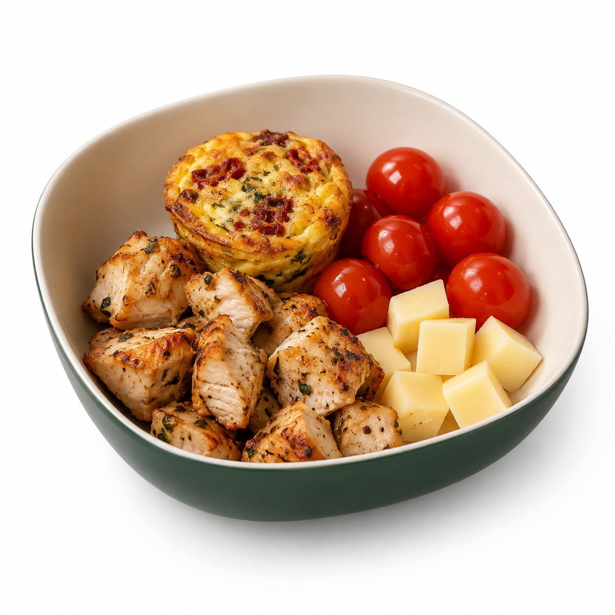 Purefect Protein Bowl with grilled chicken, sun-dried tomato mini frittata, cubed cheese and cherry tomatoes. Sun-Dried Tomatoes option shown.